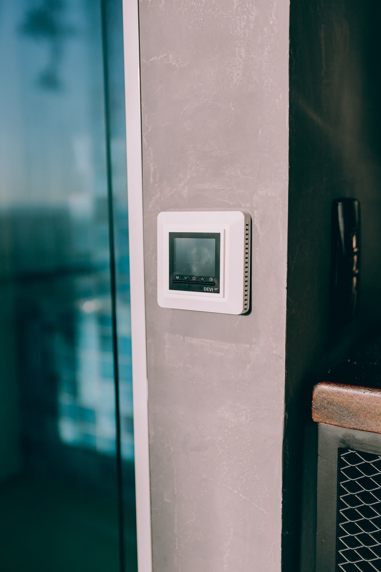 A smart thermostat on a wall